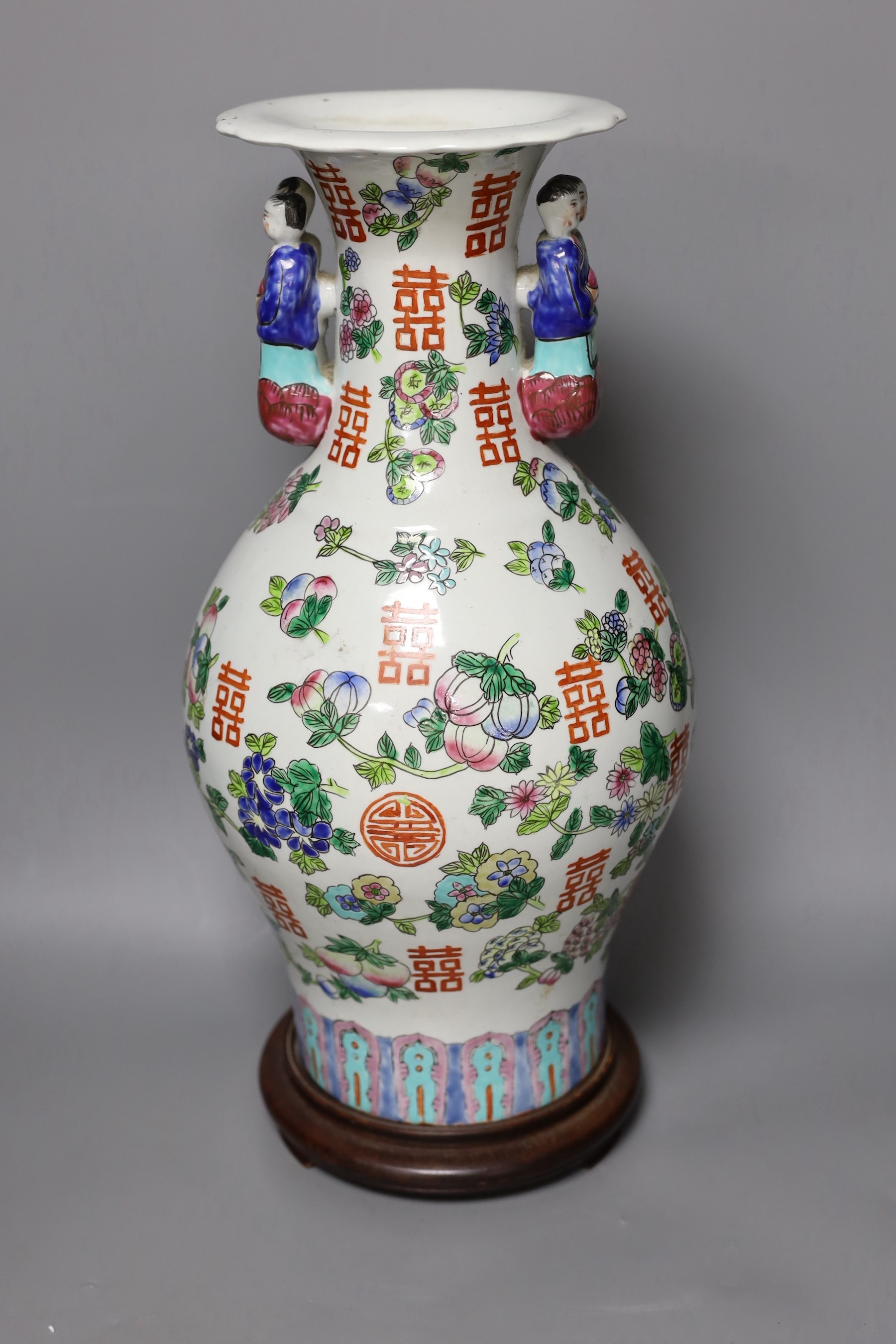 A Chinese famille rose vase, on plinth, 46 cms high